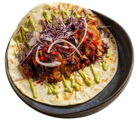 Tortilla with meat and vegetables on a white background